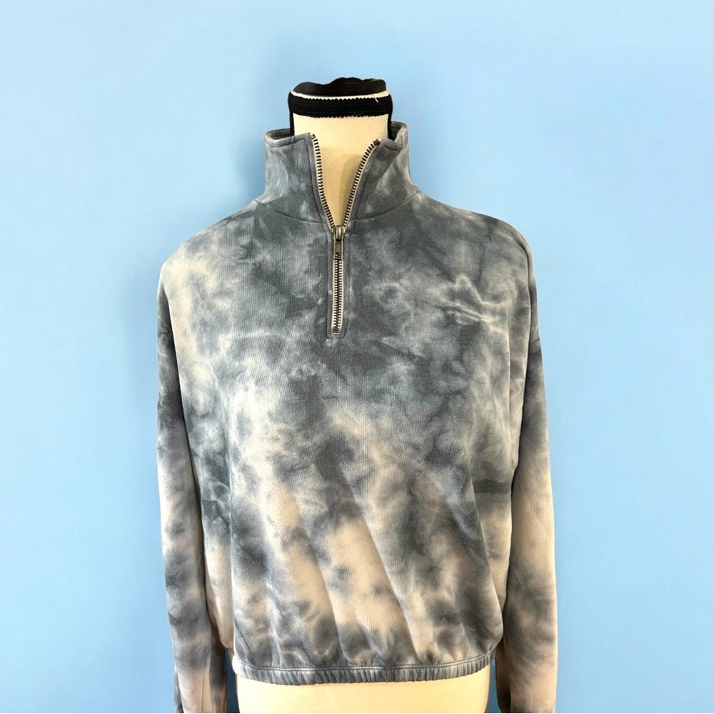 Tie-dye half-zip sweatshirt, blue and white, cropped length.